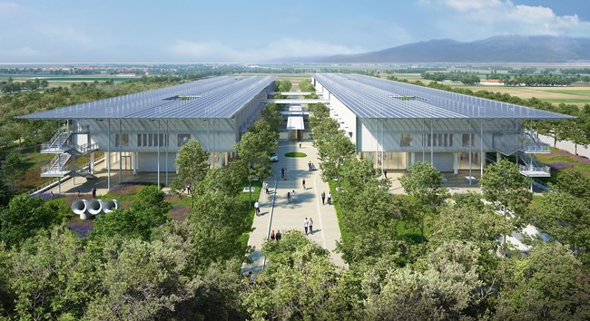 Rendering of the SNF General Hospital of Komotini with two parallel buildings connected by walkways in a verdant landscape with mountains in the background